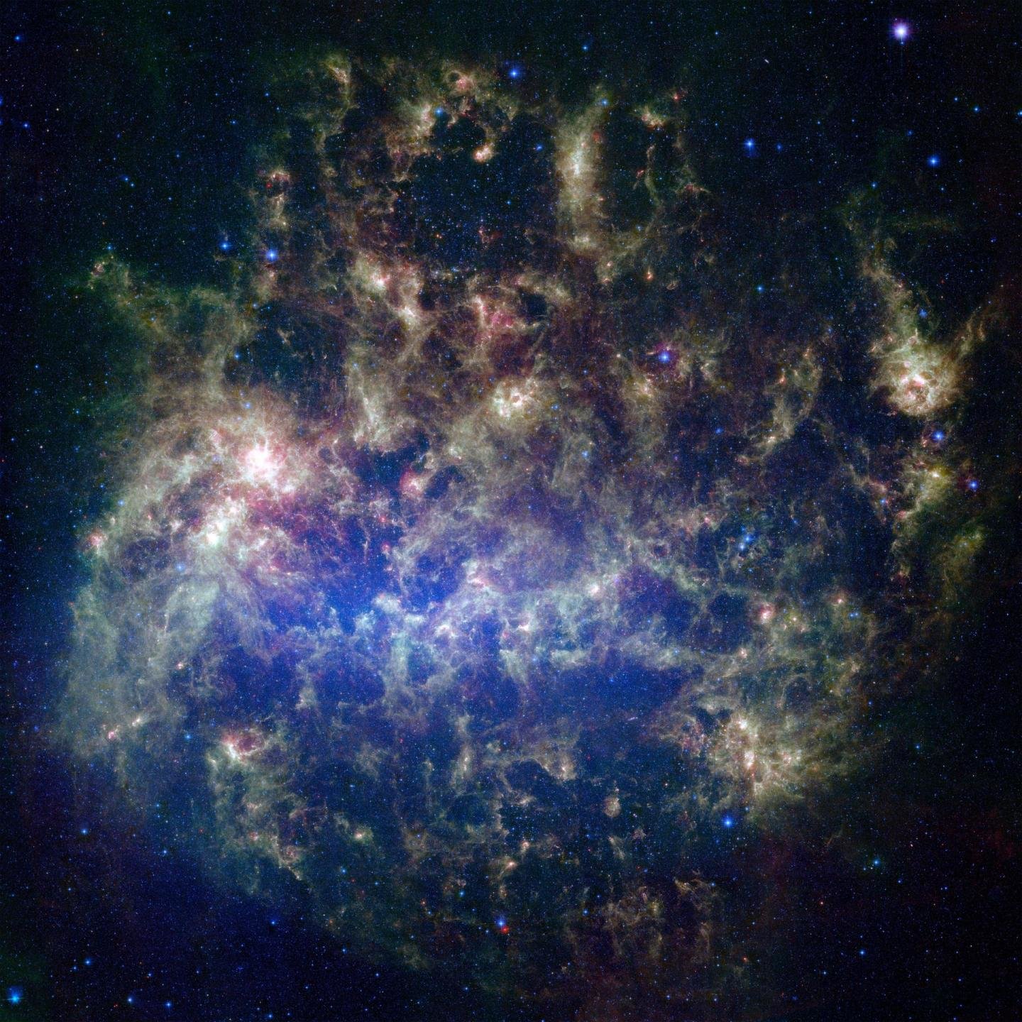 Velké Magellanovo mračno optikou Spitzerova vesmírného teleskopu. Kredit: NASA/JPL-Caltech/STScI.