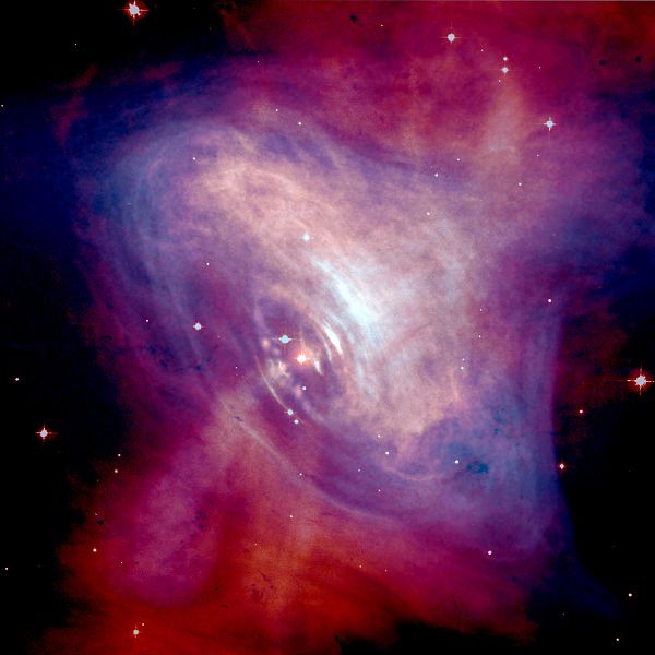 Krabí mlhovina s Krabím pulsarem. Kredit: Optical: NASA/HST/ASU/J. Hester et al. X-Ray: NASA/CXC/ASU/J. Hester et al. Volné dílo.