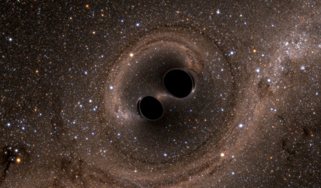 Dvojice černých děr spěje ke splynutí (zdroj SXS/LIGO).