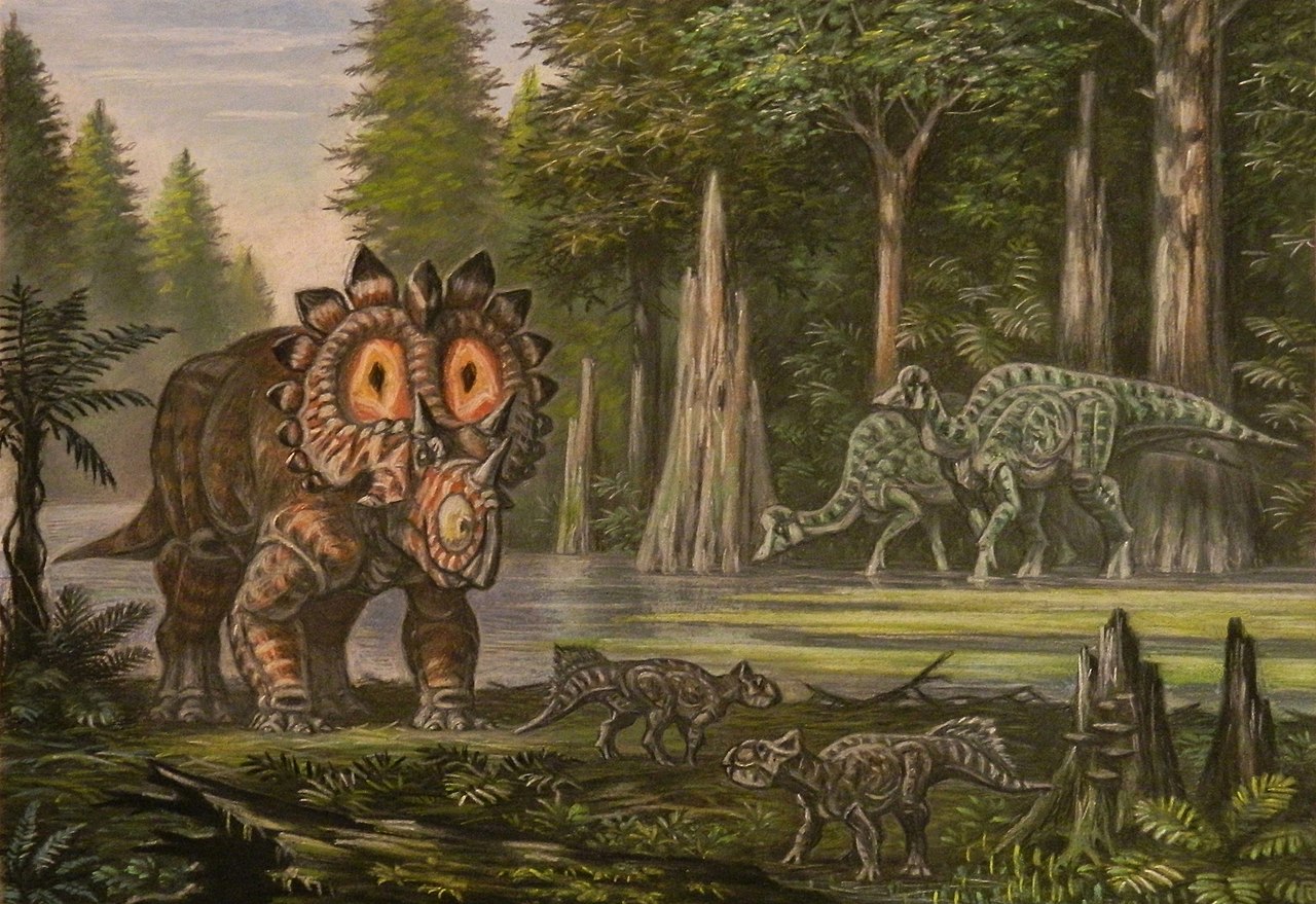 Ekologická scéna z doby před 68 miliony let, kdy na území kanadské Alberty žily početné populace kachnozobých dinosaurů (jako jsou zobrazení hypakrosauři v pozadí), i rohatých dinosaurů (jako je regaliceratops a dva malí leptoceratopsové v popředí ob