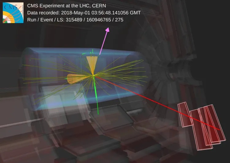 Případ produkce páru kvarků t a anti-t a jeho rozpadu na dva nabité leptony a dva výtrysky částic v experimentu CMS (zdroj CERN).