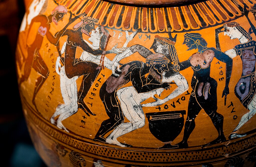Komos na černo-figurové tyrhénské amfoře. Malř Guglielmi, 550 před naším letopočtem. München, Staatliche Antikensammlungen, 1432 (J 175). Kredit: ArchaiOptix, Wikimedia Commons. Licence CC 4.0.