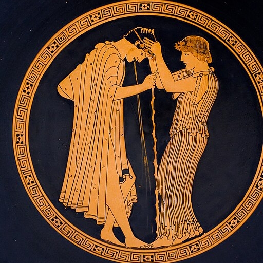 Zvracející mladík a odvážná dívka. Mladík se opírá o hůl, ale stability svého žaludku tím nedosáhne. Kromě ústředního motivu působí scéna elegantně a málem dojemně. Atický červeno-figurový kylix. Malíř Brygos, 490-480 před n. l. Würzburg, Martin von 