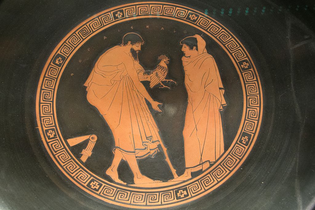 Muž přináší chlapci (popsanému jako „kalos, krásný“) dárek, 5. století př. n. l. Ashmolean Museum, Oxford. Kredit: Zde, Wikimedia Commons.