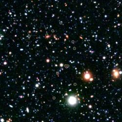 Extrémně vzdálené galaxie identifikoval i Spitzerův dalekohled (zdroj NASA).