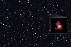 Jedna z nejvzdálenějších galaxií ve vesmíru GN-z11 zachycená pomocí Hubblova dalekohledu (zdroj NASA/Hubble).