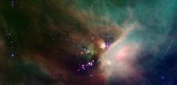 Hvězdná kolébka pozorovaná pomocí Spitzerova dalekohledu. Infračervené záření umožňuje proniknout hluboko do mlhoviny ró Oph v Hádonoši, která je okolo 410 světelných let od Země (zdroj NASA).