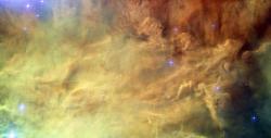 Centrální oblast emisní mlhoviny Laguna na snímku Hubbleova teleskopu. V podobném prostředí asi vznikla Sluneční soustava. Kredit: NASA, ESA.