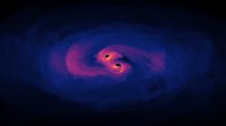 Supermasivní černé díry těsně před srážkou. Kredit: NASA's Goddard Space Flight Center.