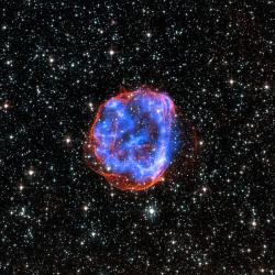Pozůstatek klasické supernovy SNR E0519-69.0 v LMC. Kredit: X-ray: NASA/CXC/Rutgers/J.Hughes; Optical: NASA/STScI.