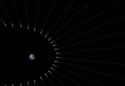 Vlasy temné hmoty s kořínky. Kredit: NASA / JPL-Caltech.