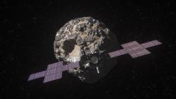 Ilustrace na kovy bohatého meteoritu Psyché obíhající Slunce v hlavním pásu asteroidů mezi Marsem a Jupiterem. V popředí sonda stejného jména, která planetku bude obíhat téměř dva roky a zkoumat její složení. Kredit: NASA/JPL-Caltech/ASU