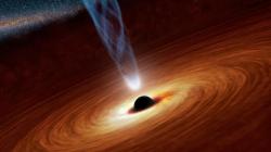 Supermasivní černá díra. Kredit: NASA/JPL-Caltech.
