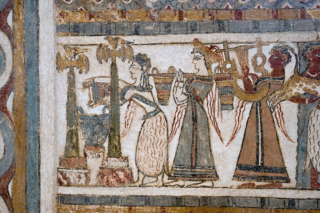 Ženy míchají obětní tekutiny mezi obřadními sloupy, hráč na lyru. Kredit: Zde, Wikimedia Commons. Licence CC 4.0.